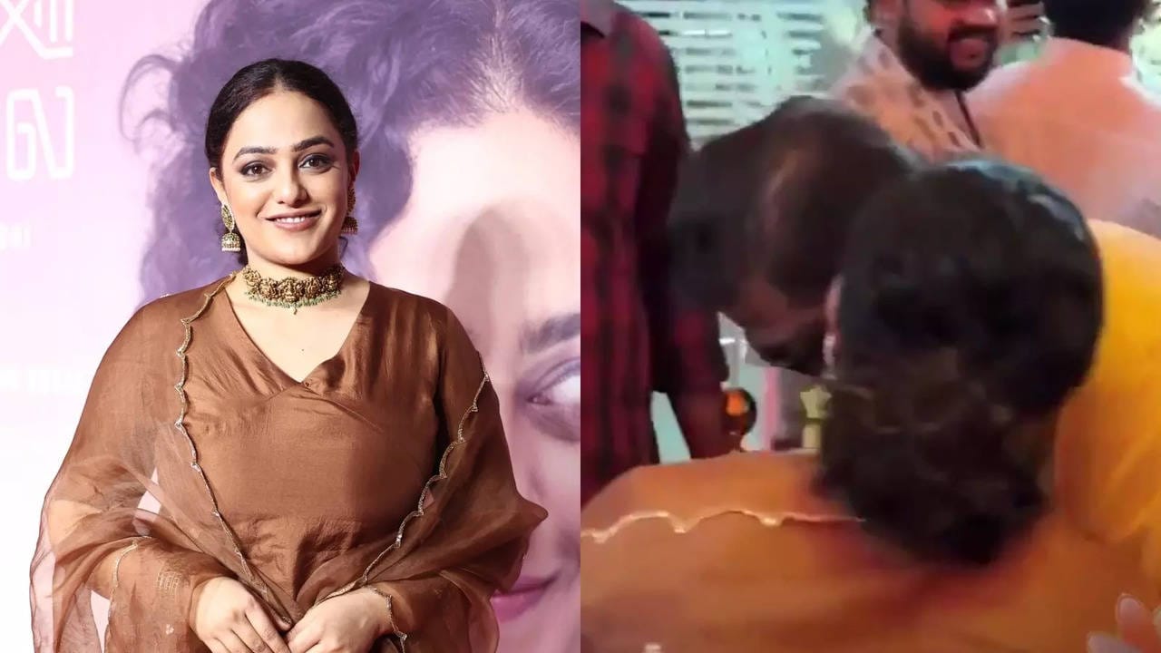 Nithya Menon's shocking behavior with a fan! Make excuses to shake hands and give them kisses and hugs..